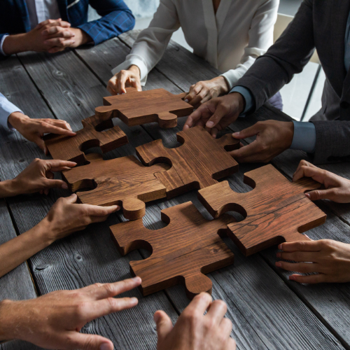 boardroom team with puzzle pieces